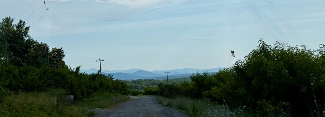 Distant mountains, seen from a gravel road on a solo bike ride